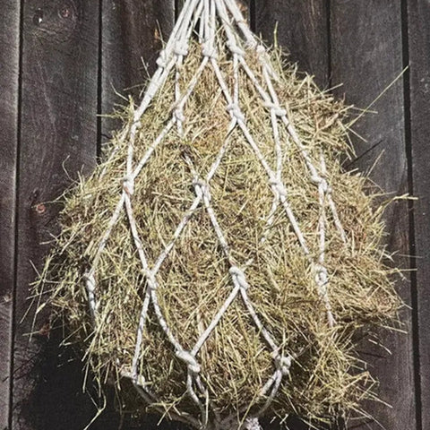 Hanging view of hay bag with hay filled in the bag 