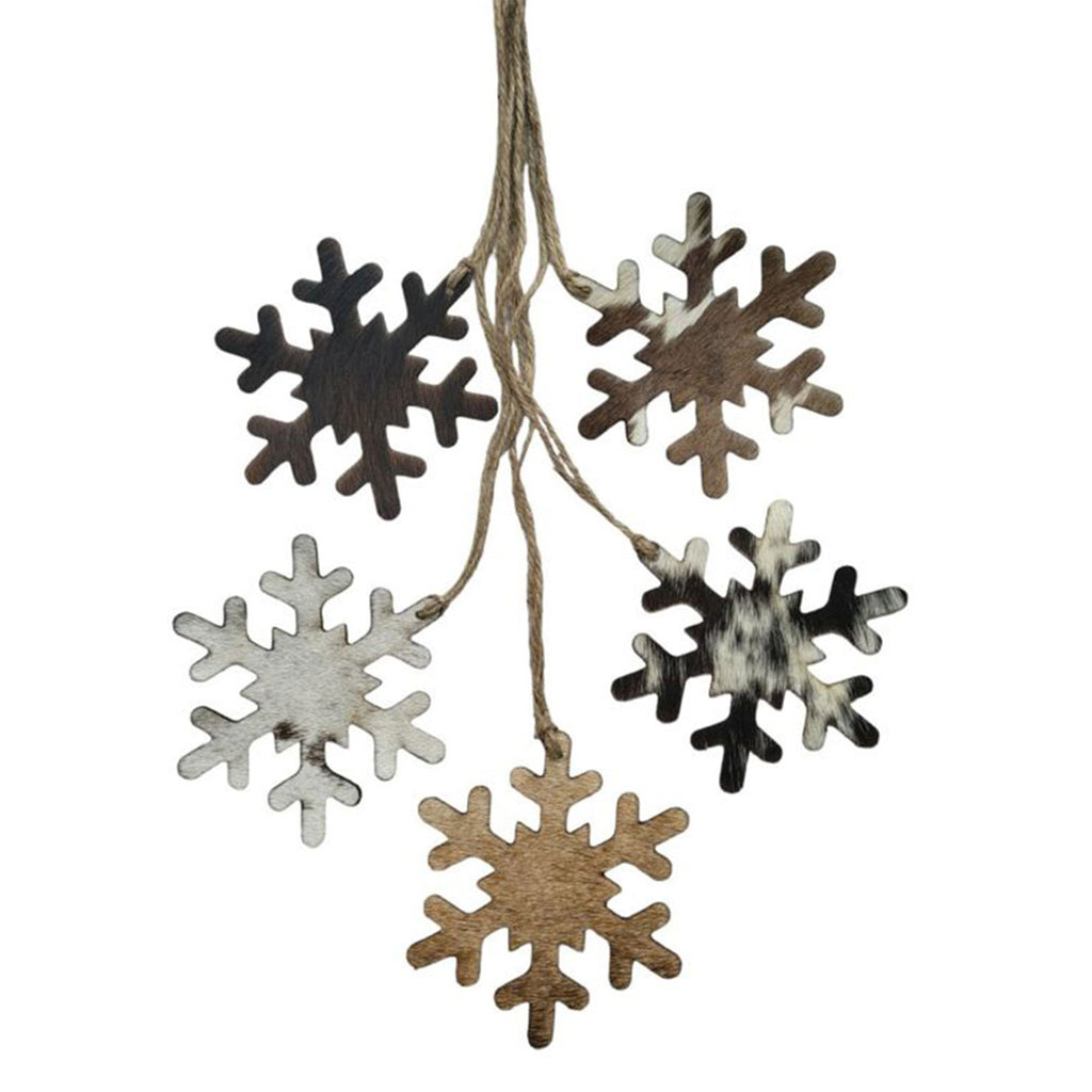 Snowflake-shaped Christmas ornament made from genuine cowhide leather with unique hide pattern