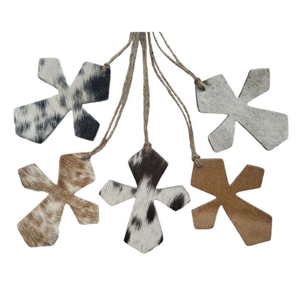 Assorted cowhide leather cross ornaments with varying hide patterns