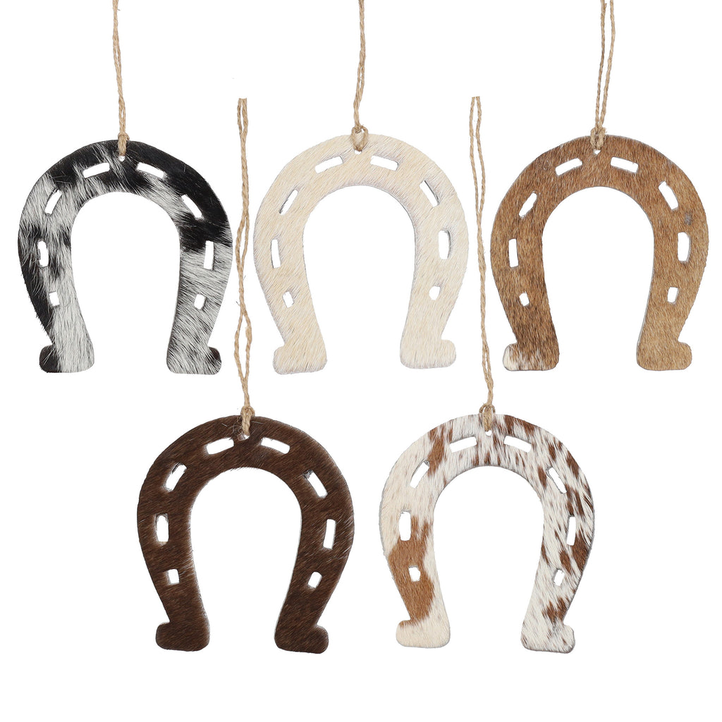 Horseshoe-shaped Christmas ornament made from genuine cowhide leather with unique hair-on hide pattern and rustic twine hanger