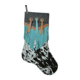 Cowhide Christmas stocking with black and white hide, turquoise fringe, and black leather back