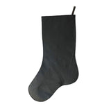 Black leather back of cowhide stocking with stitched edges and brown leather hanging loop