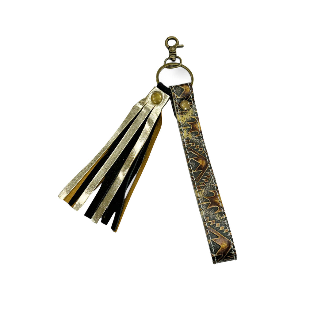 Dark leather gold toned tooled leather with gold tassel key chain