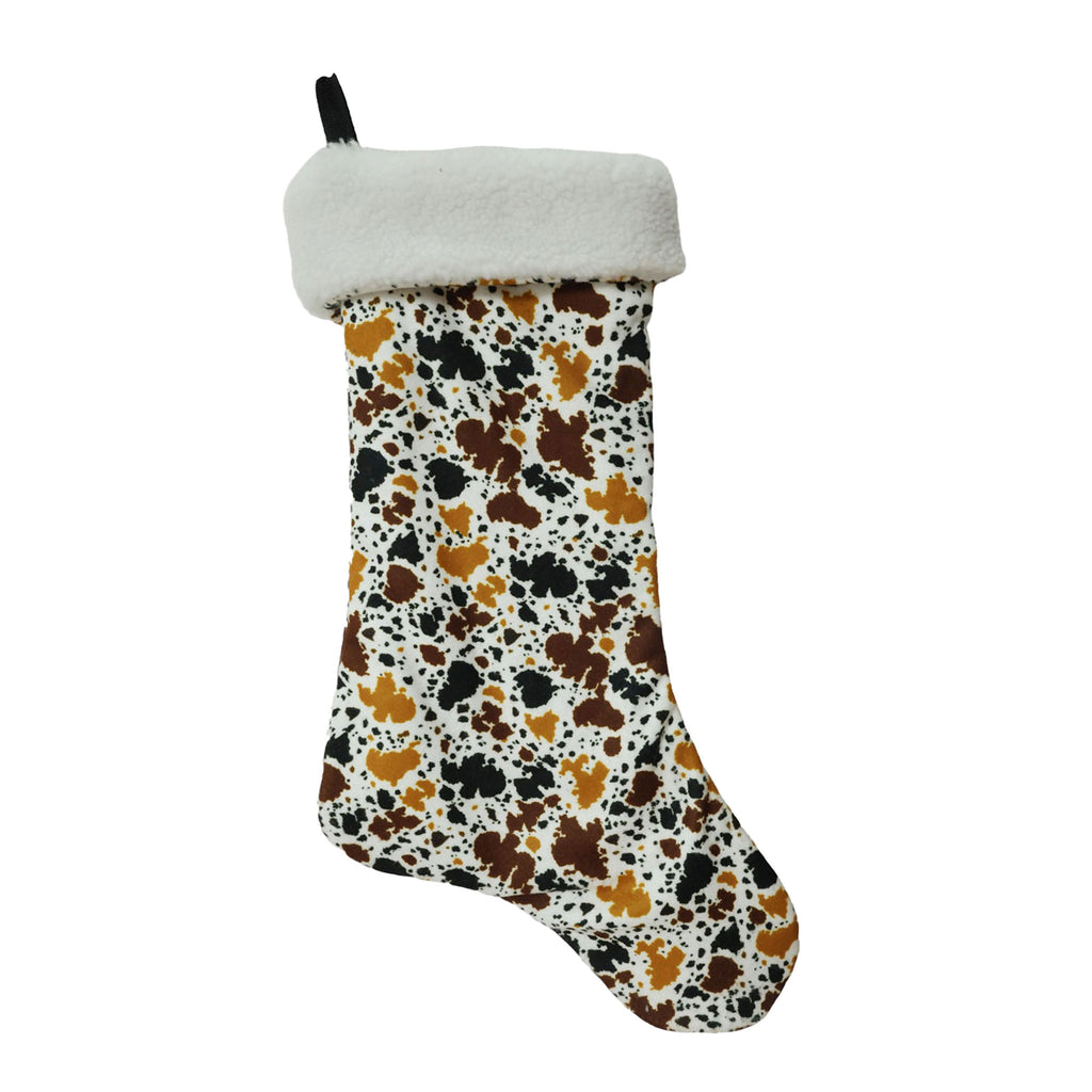 Cow print Christmas stocking with soft white fleece cuff