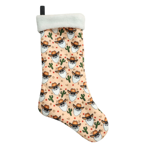 Peach-colored Cowboy Santa Christmas stocking with fleece cuff and whimsical cactus design
