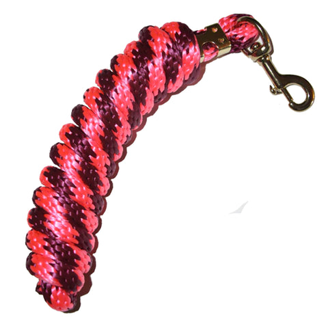 Flat lay view of coiled up pink and burgundy poly lead rope. 
