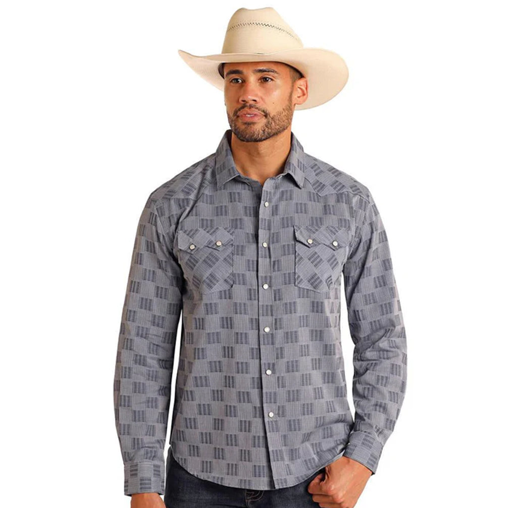 Blue/grey long sleeve pearl snap shirt with double sawtooth flap snap pockets. 