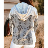 Woman wearing a grey and Southwestern pattern shacket back view
