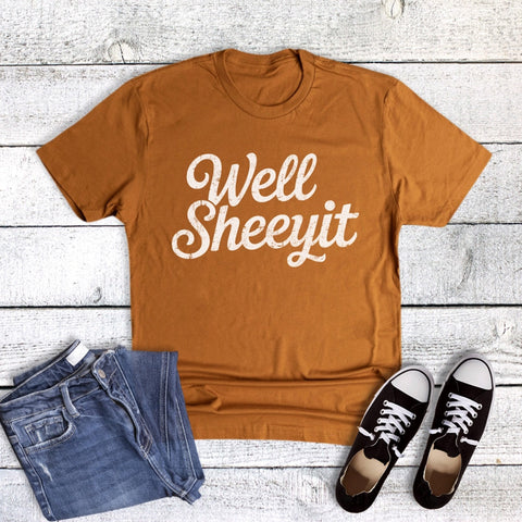 Burnt orange t-shirt with 'Well Sheeyit' text