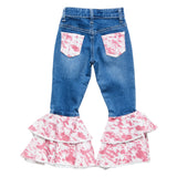 Back pockets of Girl’s Pink Cow Print Jeans with pink cowhide accents and classic stitching.
