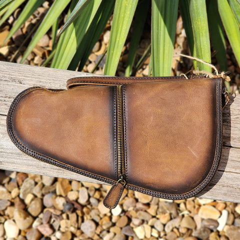 The Foreman Pistol Case is a beautiful leather pouch for storing and securing your small or medium handgun. 