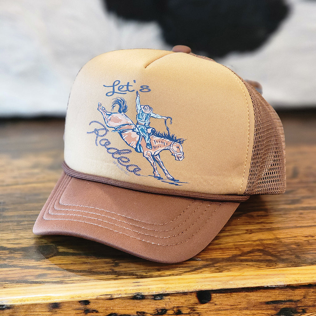 INFANT TODDLER CAP THQTA IS BROWN WITH BRONC RIDER AND BUCKING HORSE 