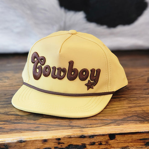 Adjustable snap back cap with cowboy written on the front of it. Cap is yellow in color 
