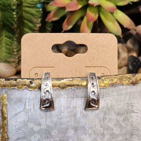 Sterling Silver post style earrings with wave like pattern on them 