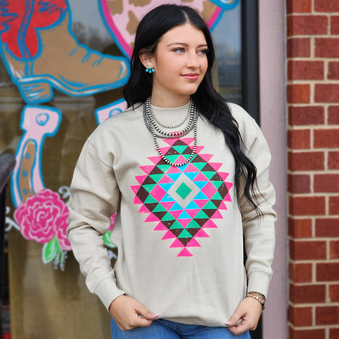 bone colored sweatshirt with neon colors in an Aztec print 