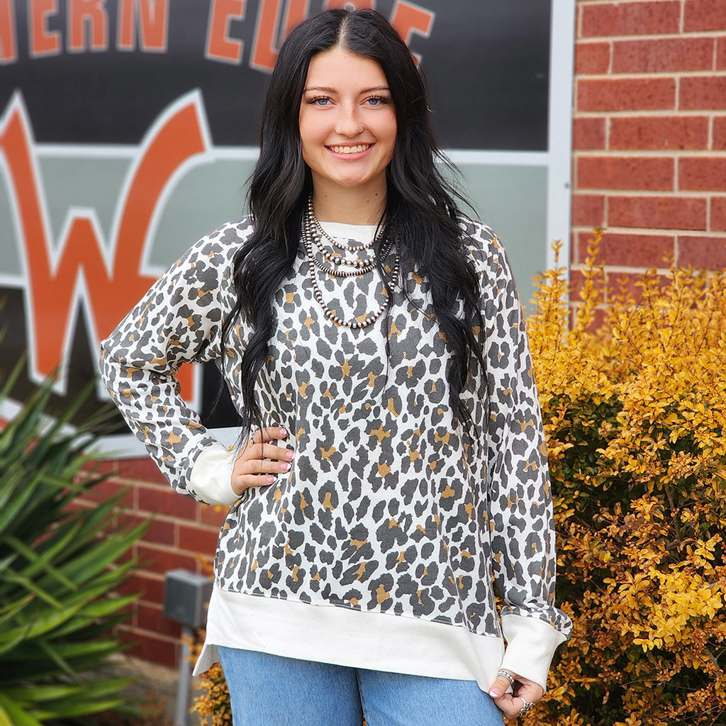 white sweatshirt with leopard print 