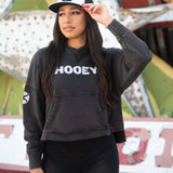 Model wearing the Hooey Roomy Black Hoody, standing front‑facing to show the relaxed fit and Western‑casual style.