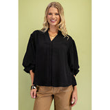 Model wearing the black 3/4 balloon sleeve blouse, front view showing the voluminous sleeves, flattering silhouette, and polished, versatile style.