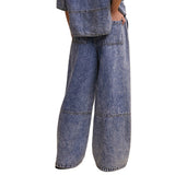 Back view of model wearing Wide‑Leg Denim Drawstring Pants showing back pockets.