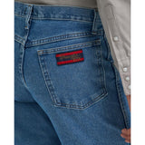 Close‑up of model wearing the Wrangler Men’s 20X Relaxed Fit Jean focusing on the pocket stitching.