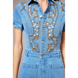Close-up of boot embroidery and denim texture on Blue B Women's Western romper 