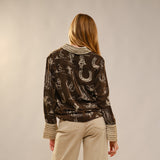 Back of the shirt, ruffled collar and designs go all the way around.