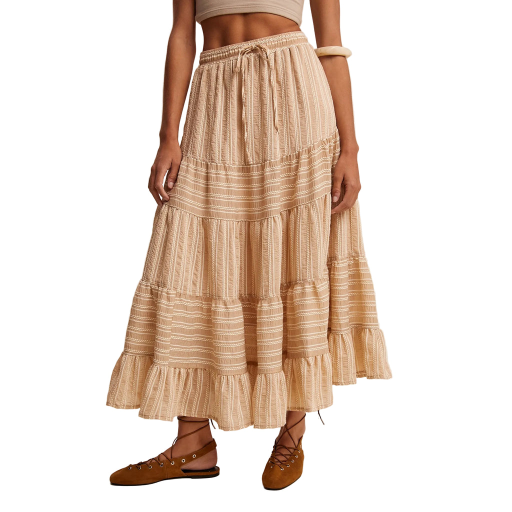 Model wearing a tiered maxi skirt showing the breezy flow, lined design, and romantic boho‑Western silhouette.