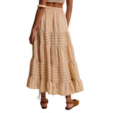 Back view of model wearing a tiered maxi skirt showing the flowing tiers and easy, airy movement.