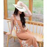 Close‑up of model wearing the Apricot Boot Stitch Dress showing the embroidered boot‑stitch pattern.