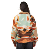 Back view of the model in the Mint and Orange Aztec Fleece 1/4 Zip, displaying the full Aztec pattern across the back.