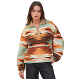 Model wearing the Mint and Orange Aztec Fleece 1/4 Zip from the front, showing the bold pattern and soft fleece texture