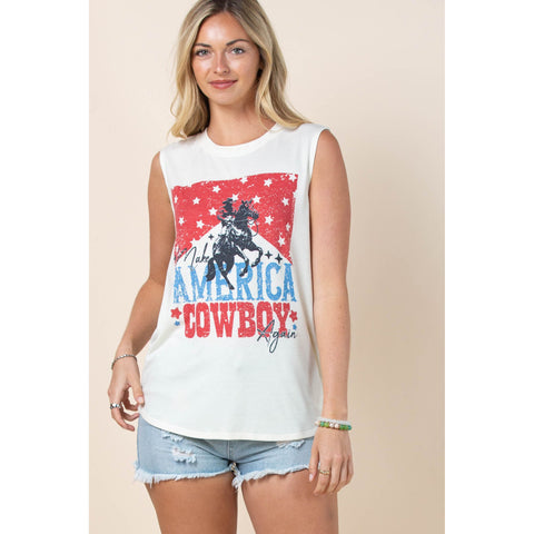 Female model wearing a patriotic Western Make America Cowboy Again tank featuring a distressed American flag and cowboy silhouette.