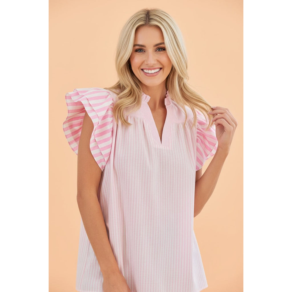 Model wearing the pink and white stripe flutter sleeve blouse, front view showing the soft flutter sleeves and classic striped pattern.