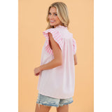Back view of model wearing the pink and white stripe flutter sleeve blouse showing the clean stripe layout and easy, comfortable fit.