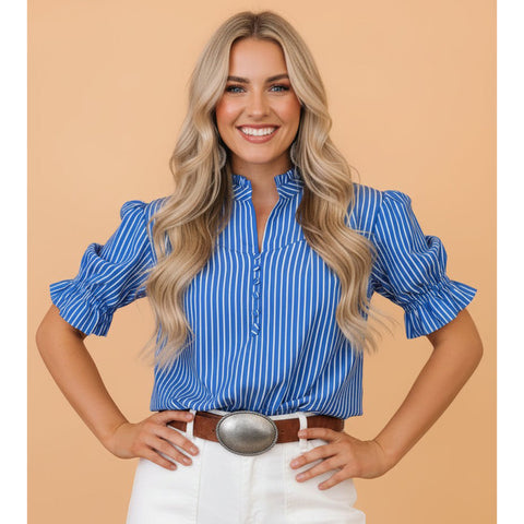 Model wearing the blue and white stripe ruffle puff sleeve button‑front blouse, front view showing the puff sleeves, ruffle trim, and classic stripe pattern.
