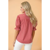 Back view of model wearing the red and white striped puff sleeve blouse showing the clean stripe layout and easy, comfortable fit.