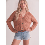 Model wearing a cafe‑colored knotted cardigan sweater front view.