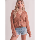 Model wearing a cafe‑colored knotted front cardigan sweater, front view showing the soft knit fabric, relaxed fit, and charming knotted detail.