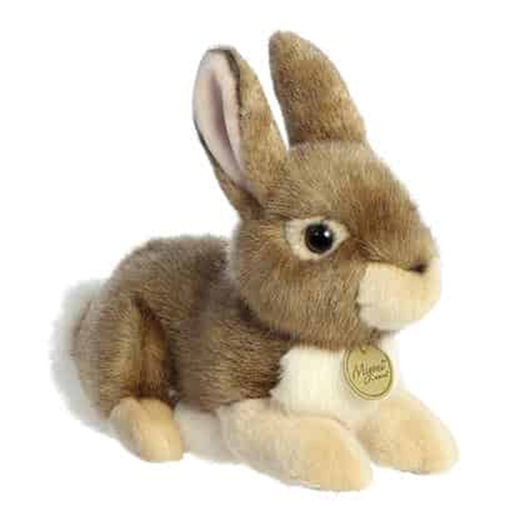 super soft faux fur and cotton ball type tail stuffed animal bunny Brown, cream and white in color.
