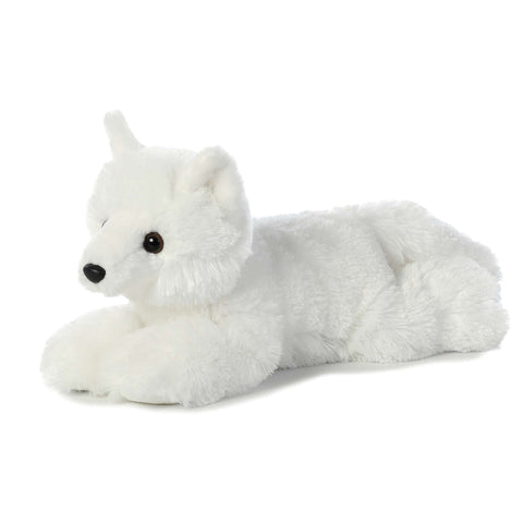 White plush toy fox lying on it's belly