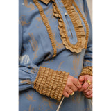 close up view of ruffled sleeve and front of Western Graphic Ruffle Tie Waist Mini Dress