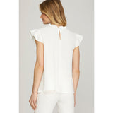 Back view of off-white pintuck blouse with ruffle sleeves