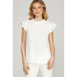 Front view of off-white pintuck blouse with ruffle sleeves