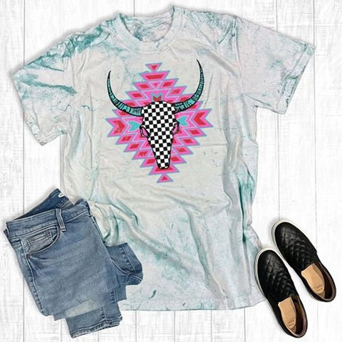 Sea glass tee with checkered cow skull and pink Aztec graphic, printed on soft cotton fabric