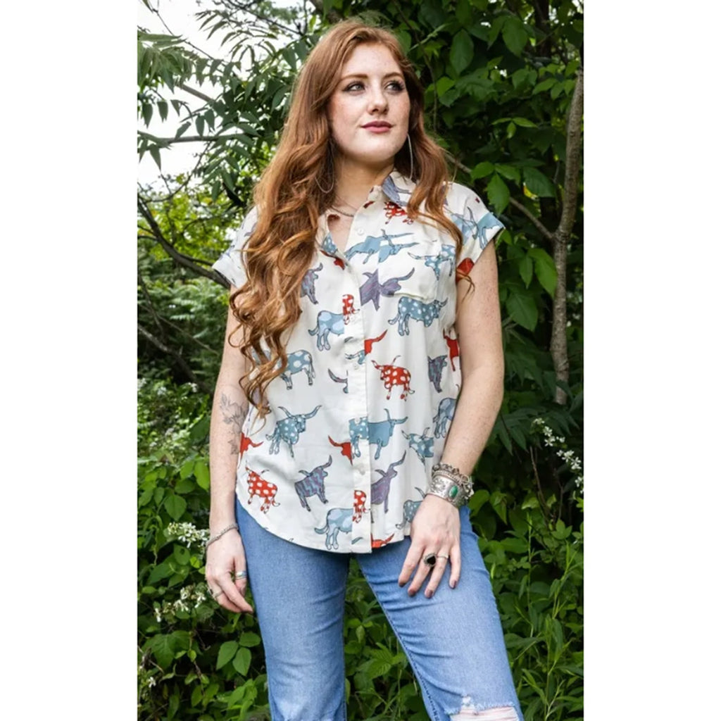 Model wearing the Ivory Arty Longhorn Camp Shirt, front view showing the bold longhorn graphic, relaxed camp‑shirt fit, and soft ivory fabric.