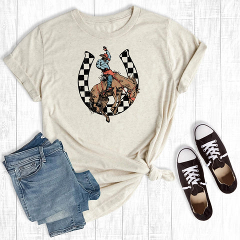 Oatmeal tee with checkered horseshoe and bronc rider graphic printed on soft cotton blend fabric
