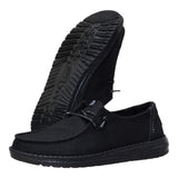 Women's black slip-on casual shoes with subtle shimmer effect