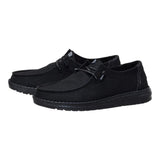 Women's black slip-on casual shoes with subtle shimmer effect