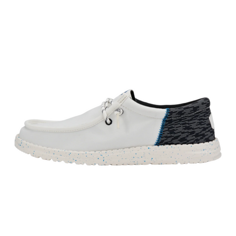 White shoe with black and white heel 