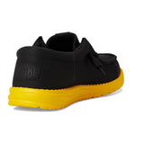 men's low top black sneaker with yellow bottom